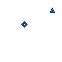 blue triangle at grid (4, 1), size 1, quarter-turn orientation 0, filled, no dot; blue diamond at grid (2, 2), size 1, quarter-turn orientation 2, filled, center dot. Grid coordinates describe a four-by-four tile; editorial descriptions are not validated accommodations.